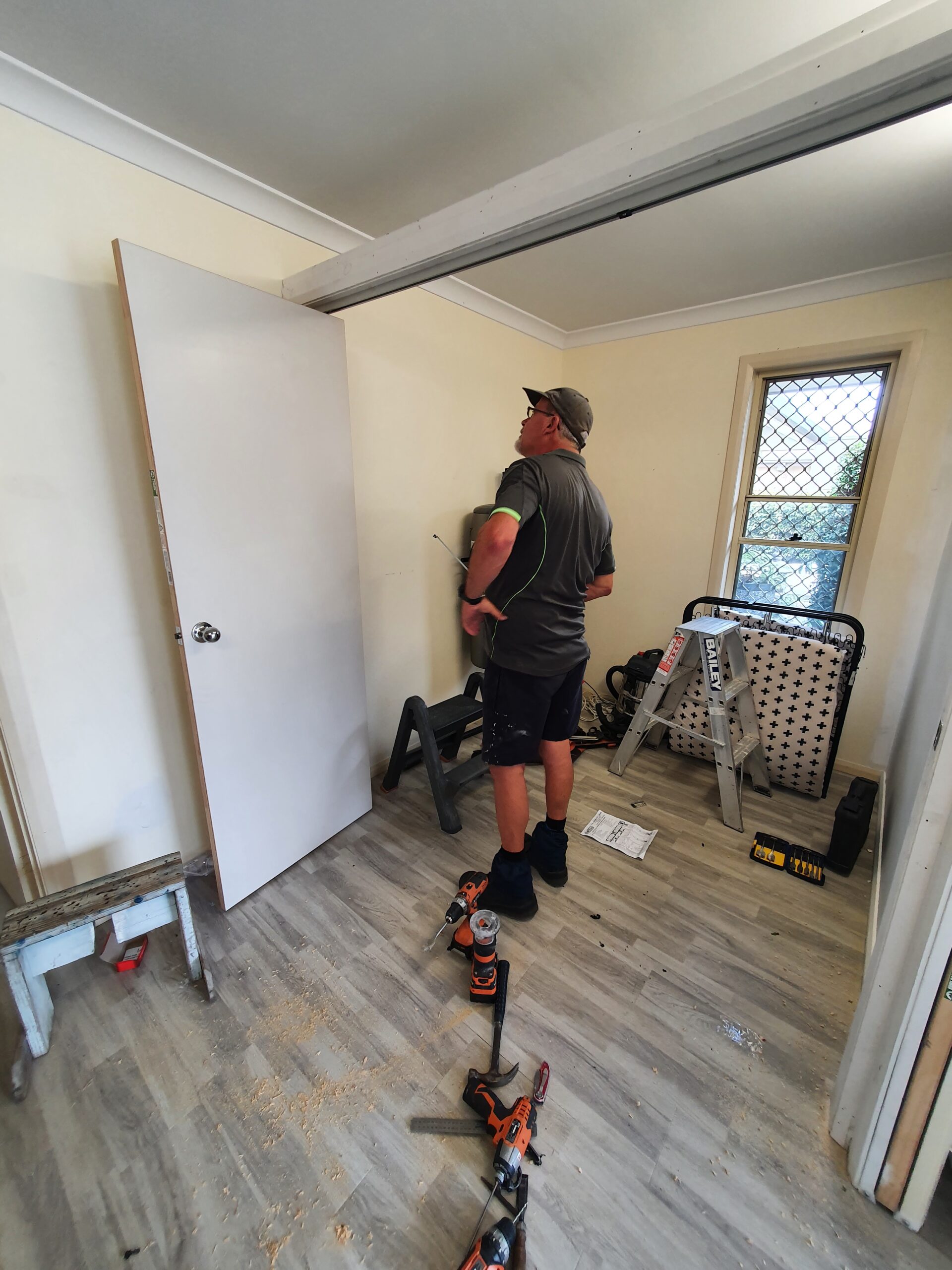 image of a sliding panel door being maintained