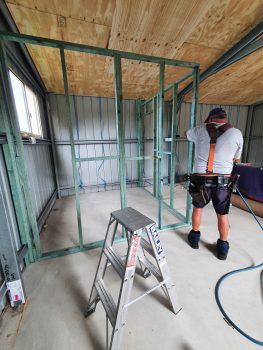 image of a person constructing timber framework